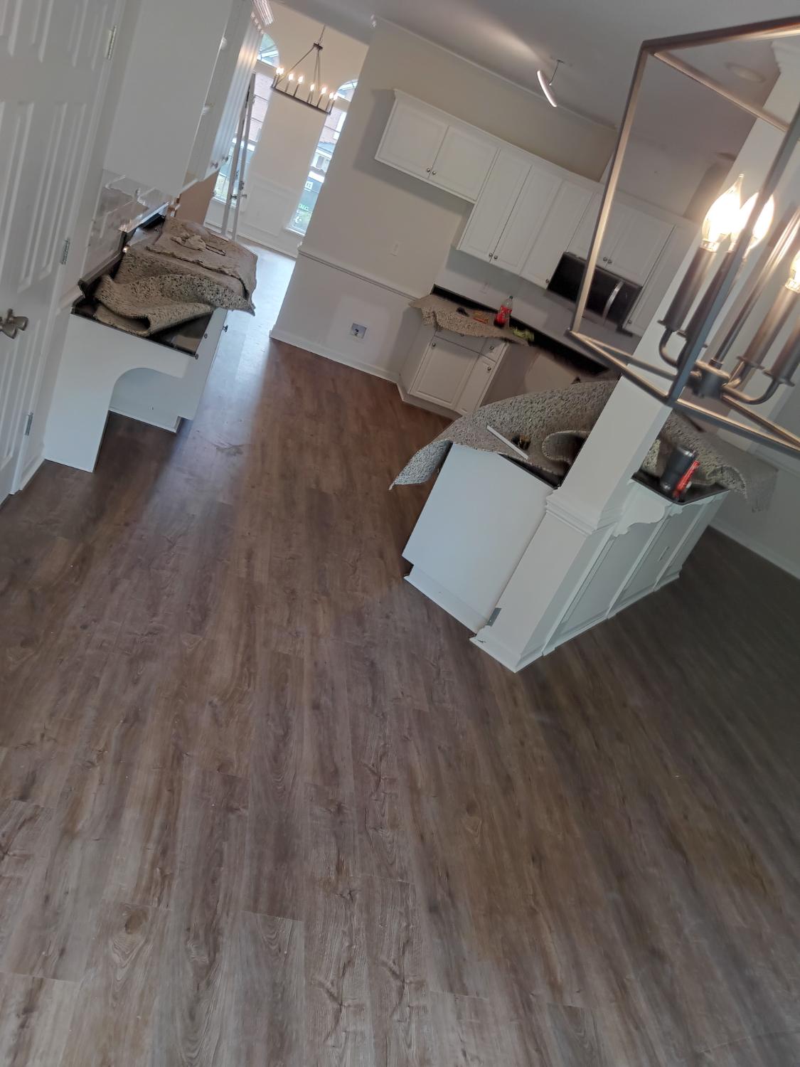 Kitchen and dining with medium LVP