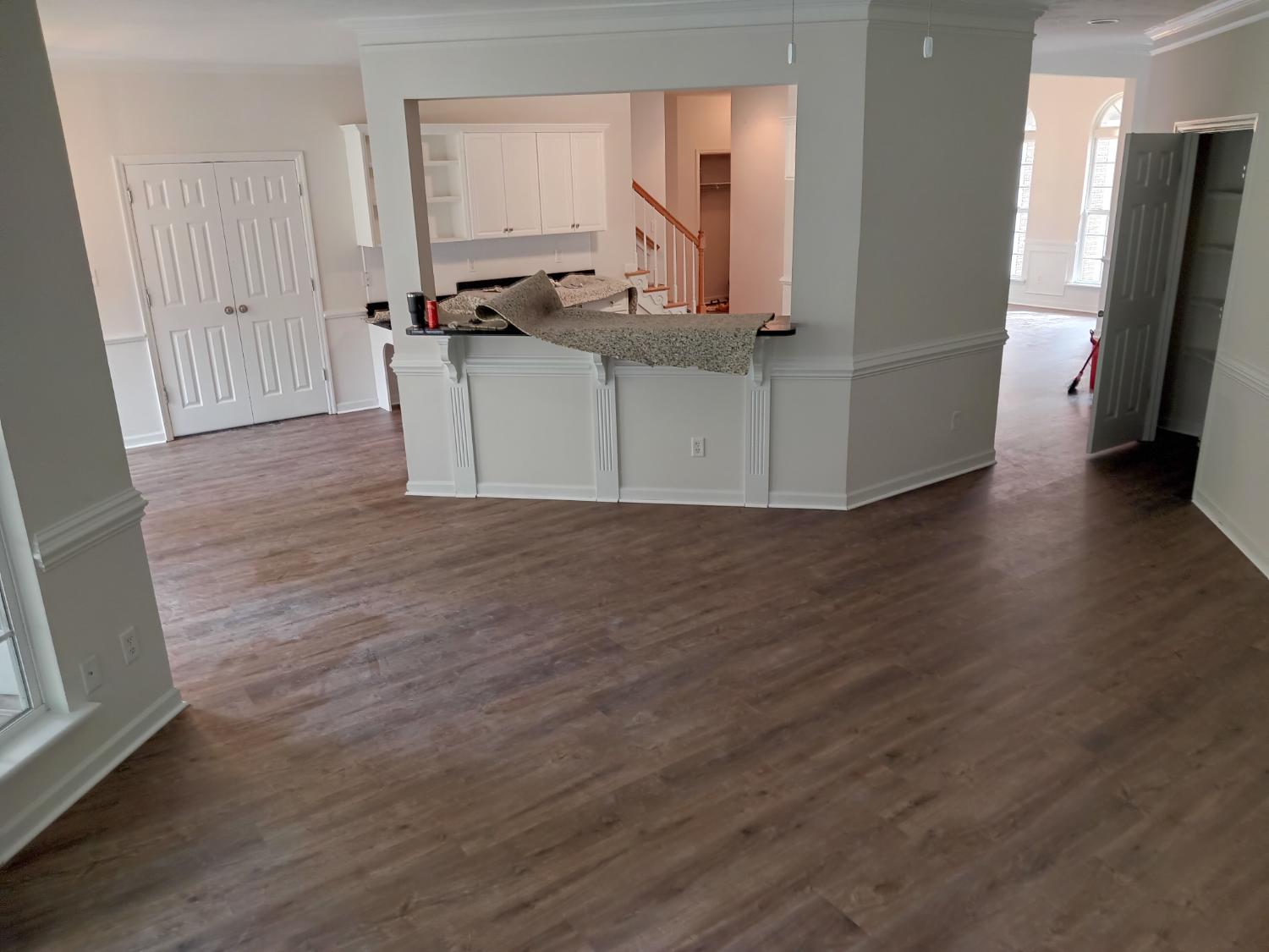 Open concept with medium brown LVP