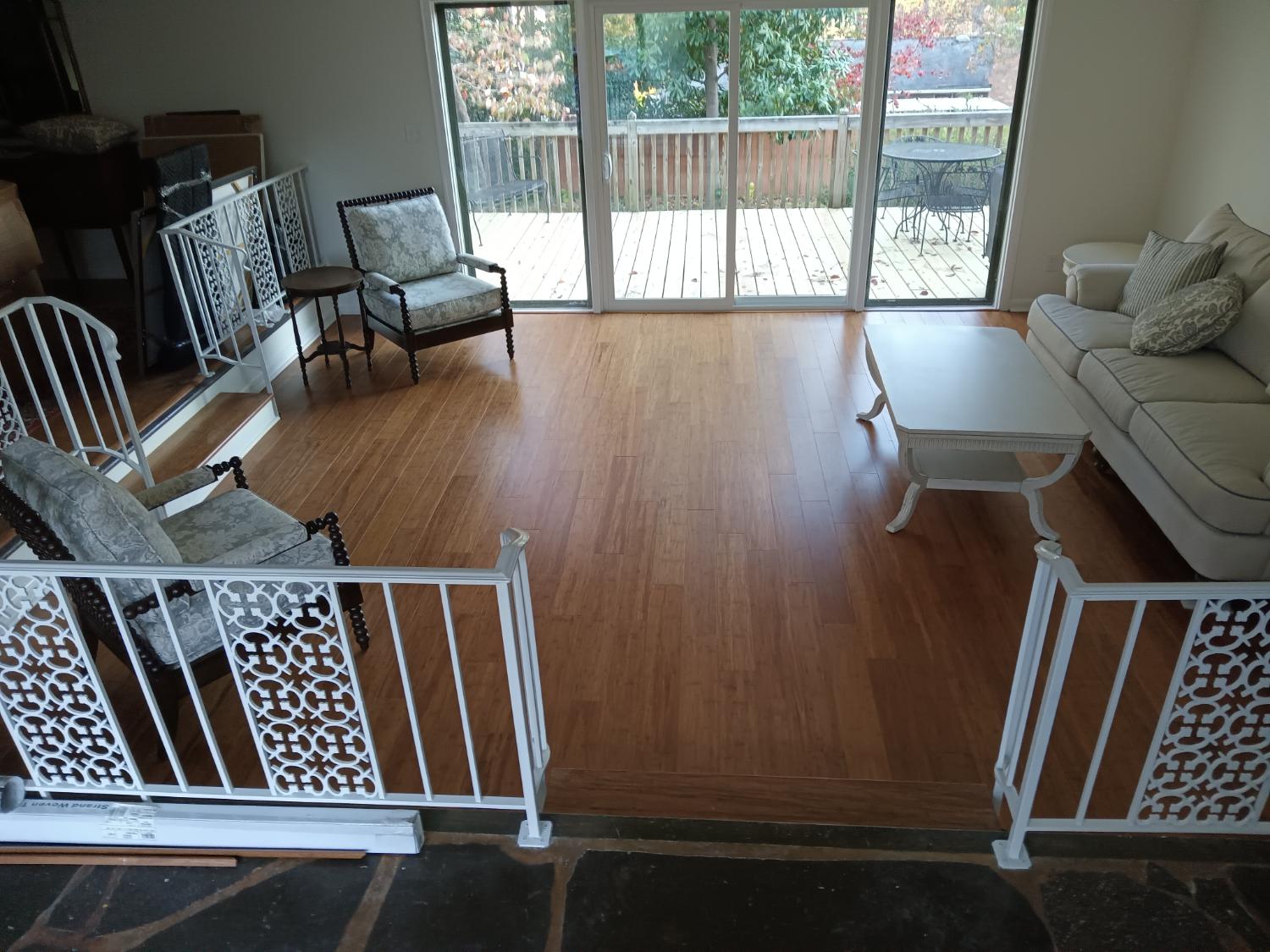 Sunroom with warm wood flooring