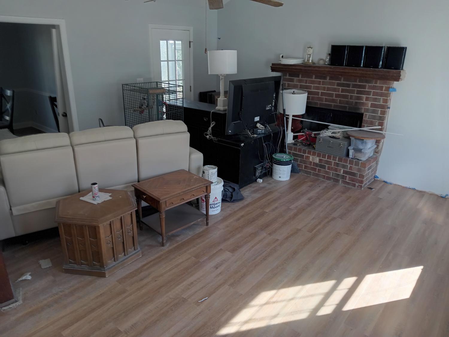 Living room with light LVP and fireplace