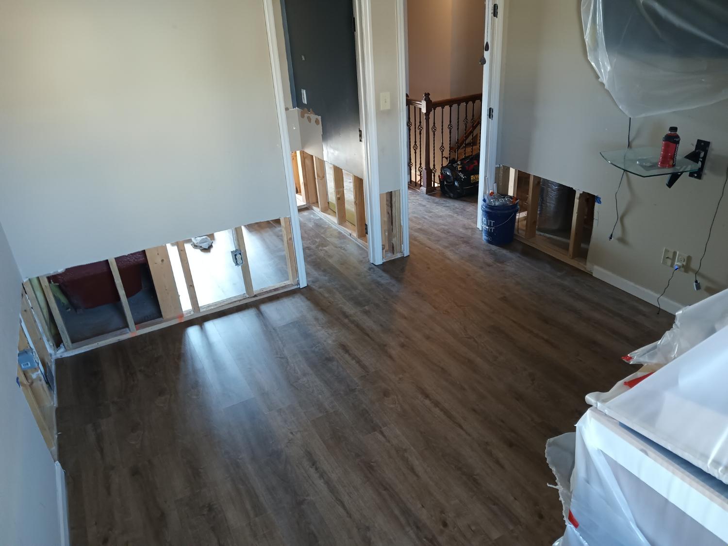 Open area with dark LVP during renovation