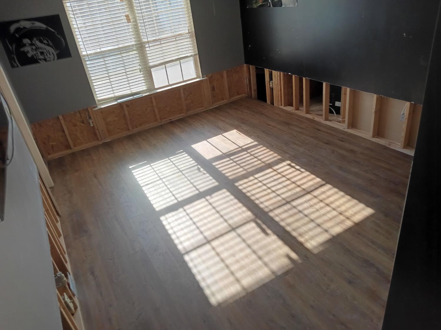 Room with window light and medium LVP