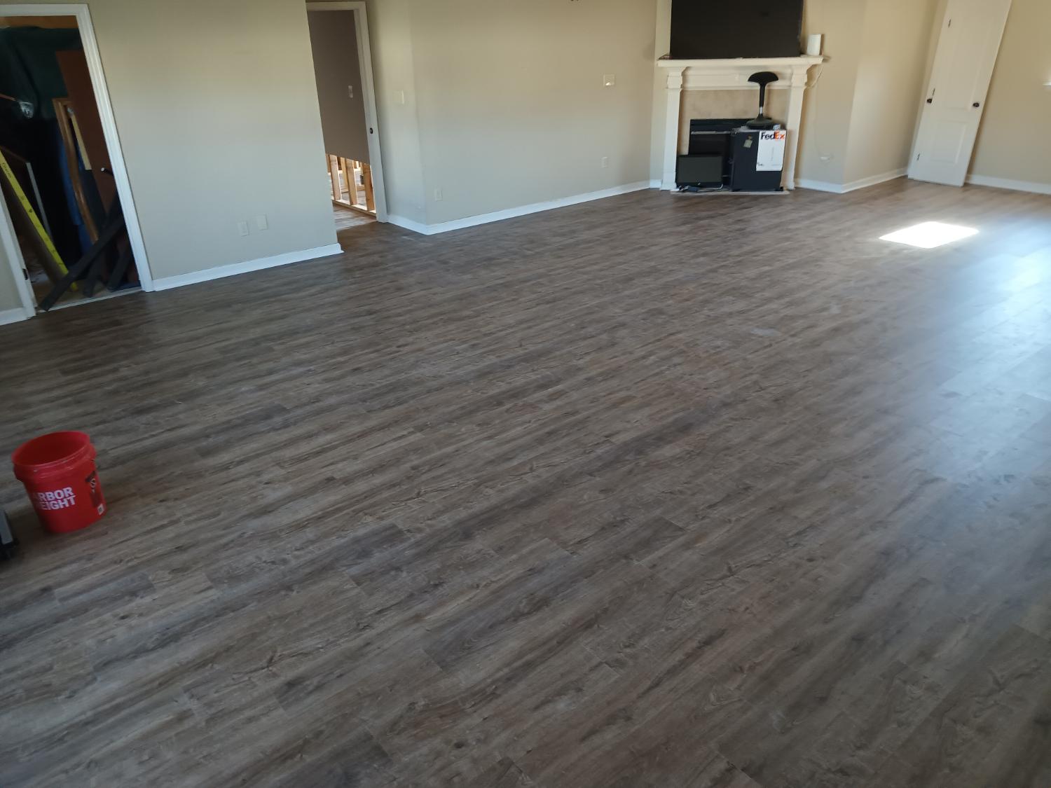 Large open room medium gray LVP