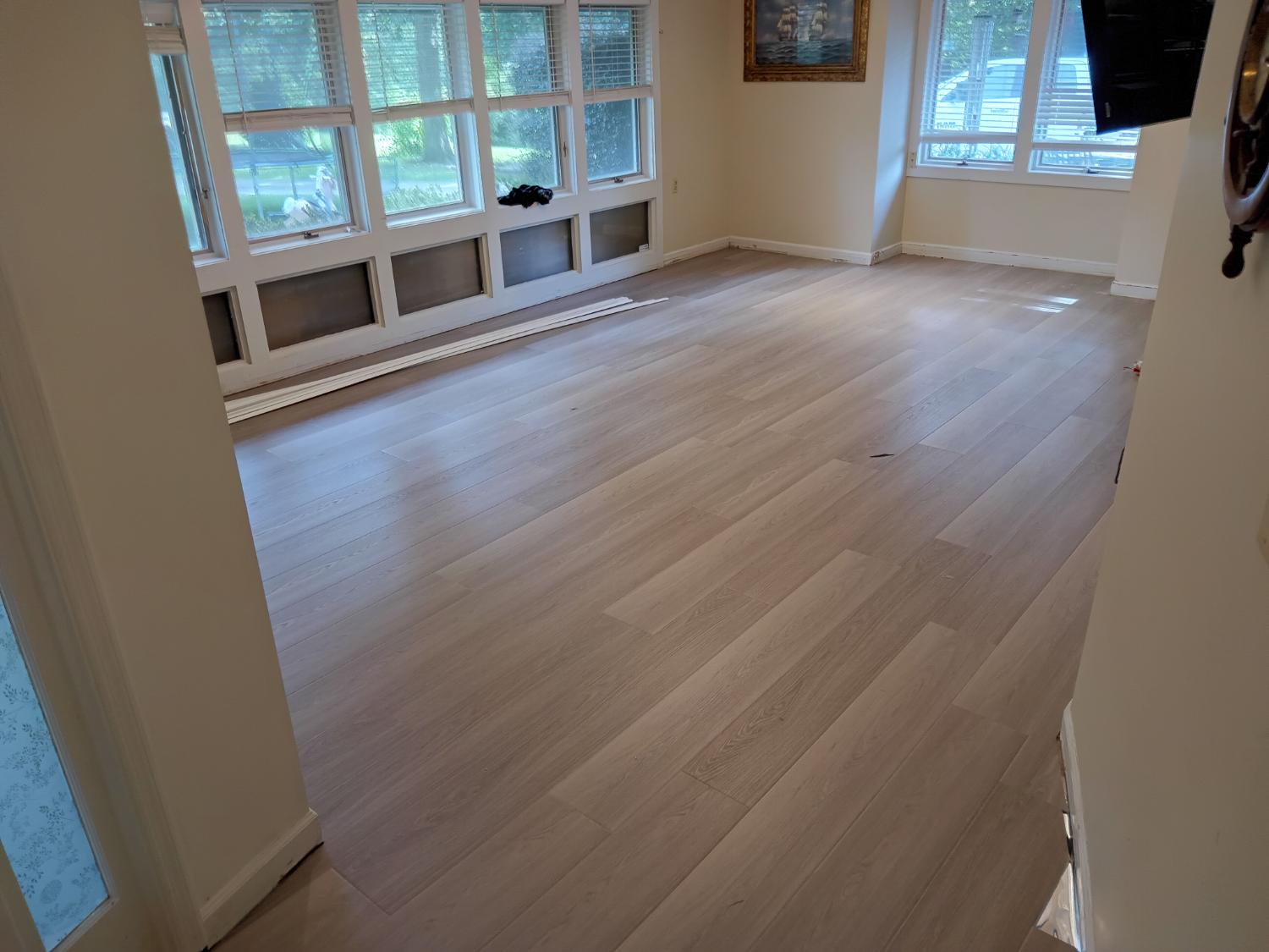 Bright sunroom with light wood-look LVP