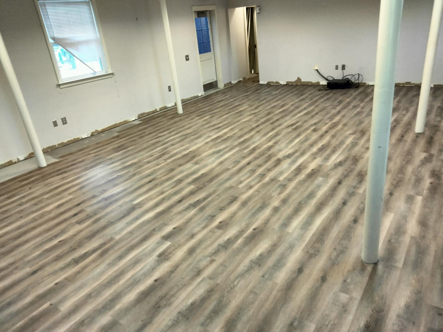 Large room with light gray LVP